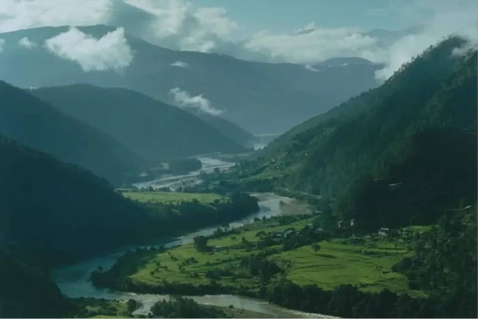 A river winding through a green Bhutanese valley